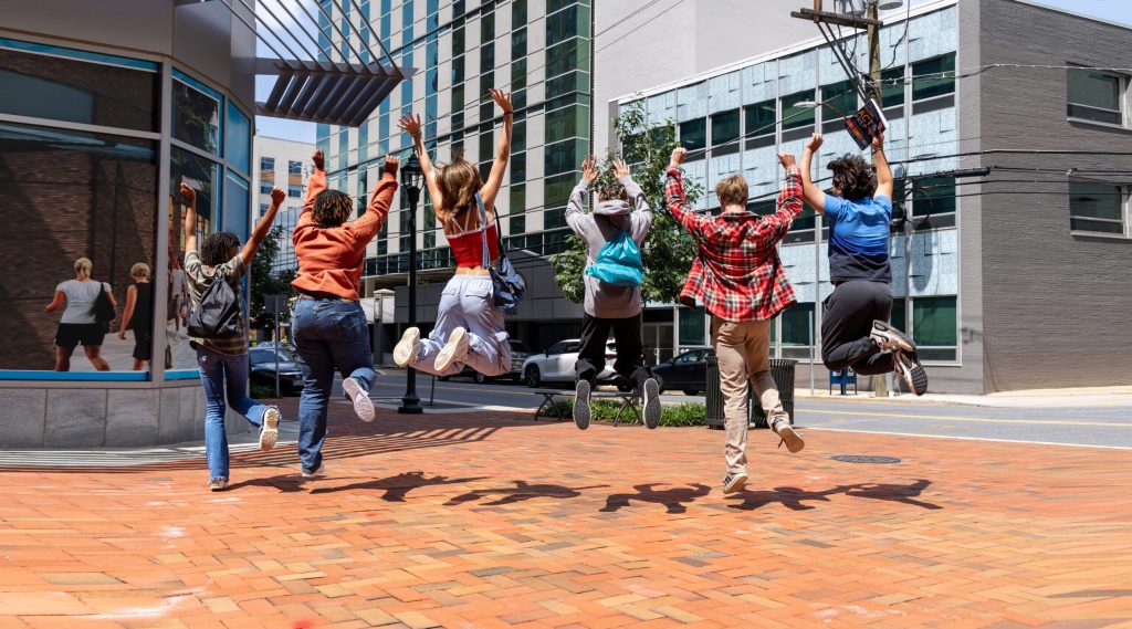 Students jumping for joy after successful results from the best SAT Preparation Class.
