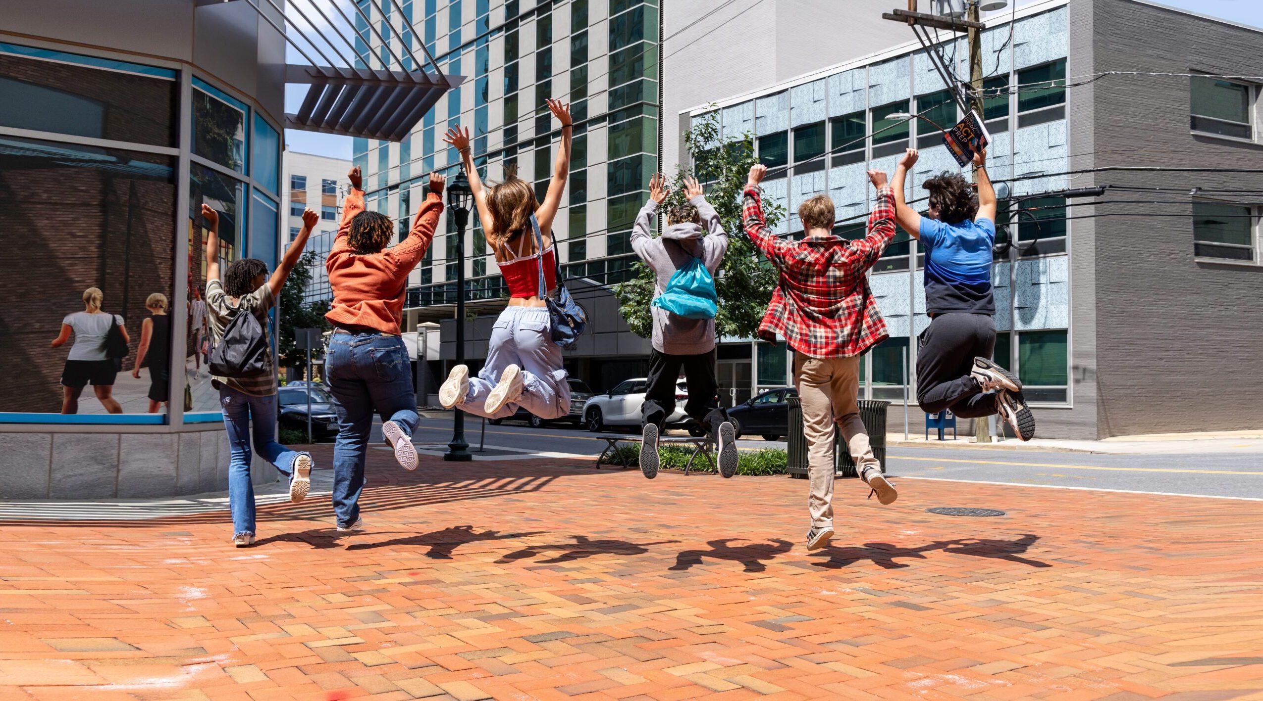 Students jumping for joy after successful results from the best SAT Preparation Class.