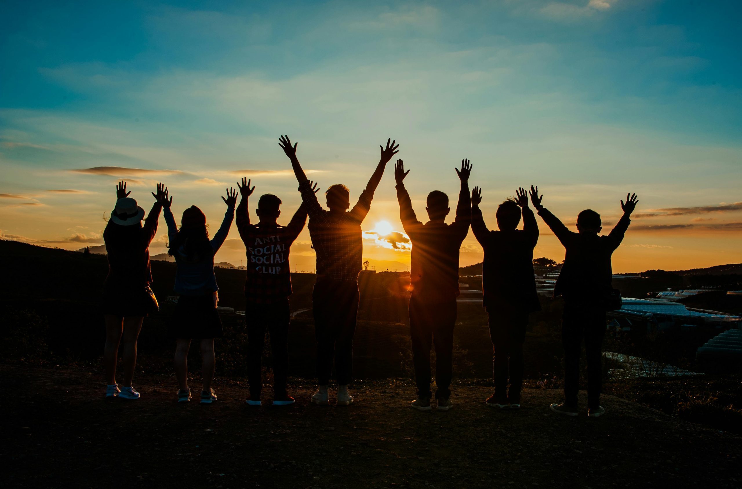 College students gathered to watch a sunset.