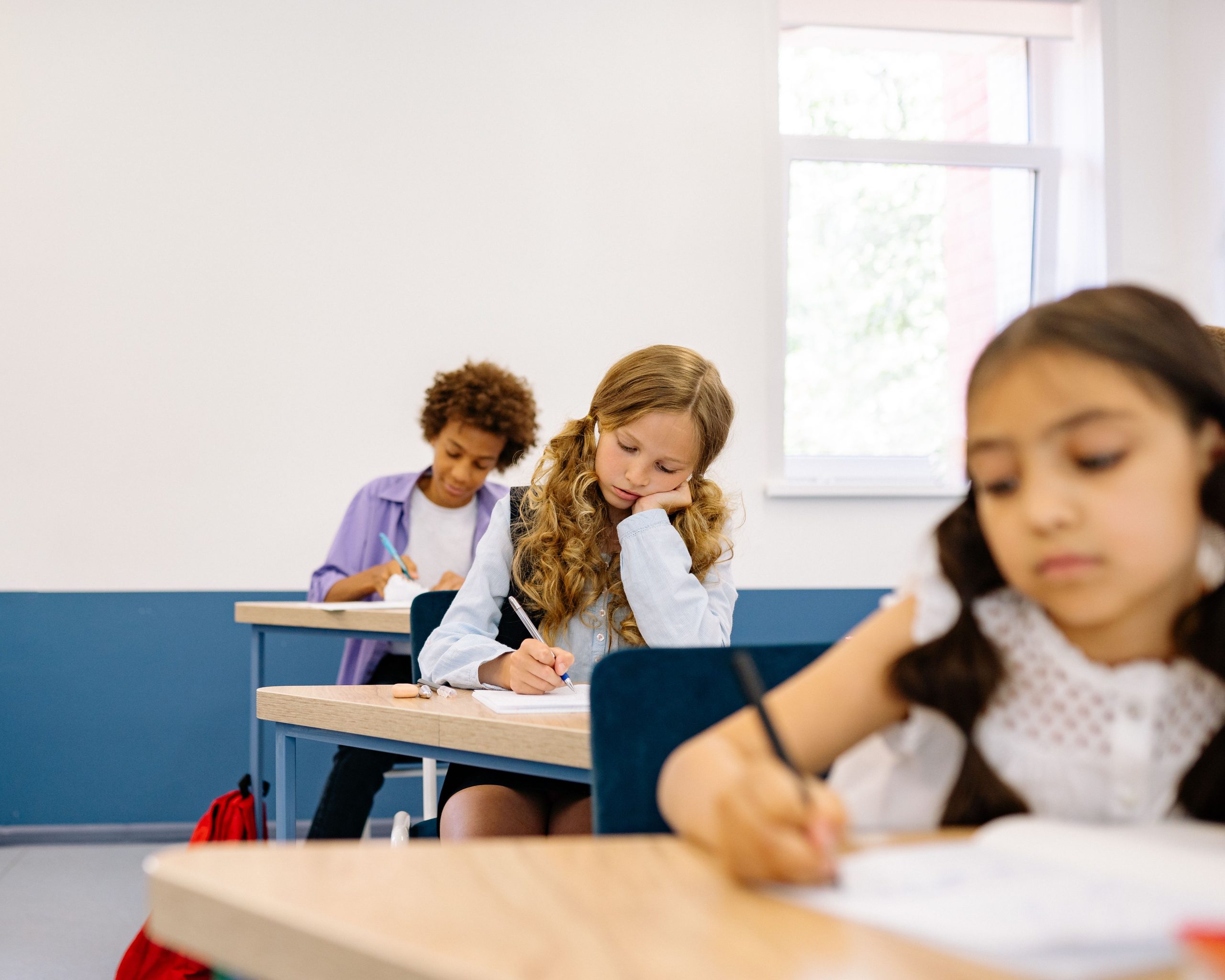 Students sitting at their desk bubbling in answers on the SSAT.